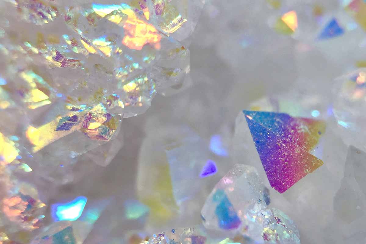 Meditating-with-Rainbow-Aura-Quartz-and-its-Healing-Properties